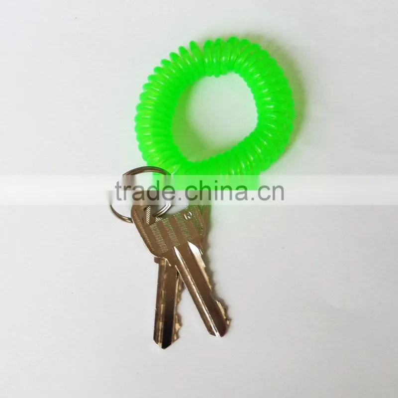 Cheap 5cm diameter soft round plastic wrist coil keychain