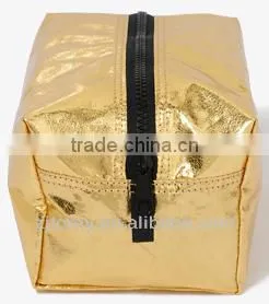Fully lined distressed metallic cosmetic bag featuring a contrast zipper