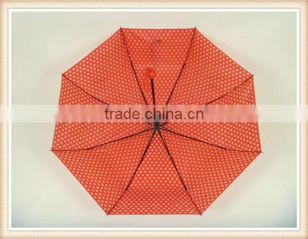 Red fold umbrella with white flower handle color match the fabric