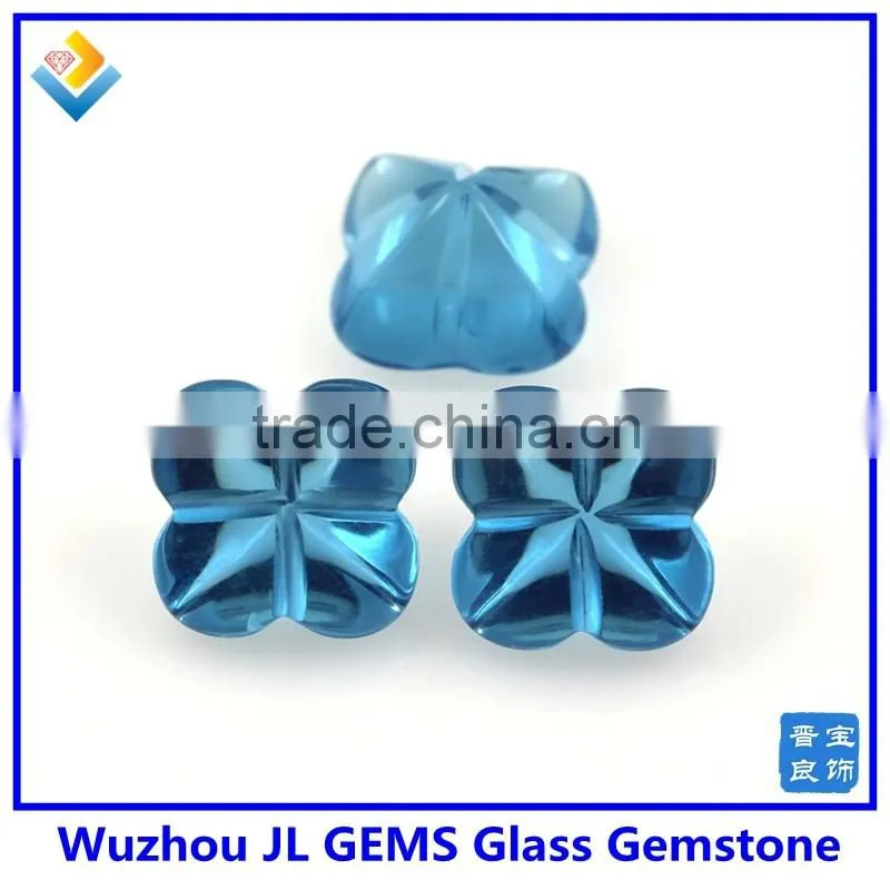 Synthetic glass gem stone with four leaf clover stone
