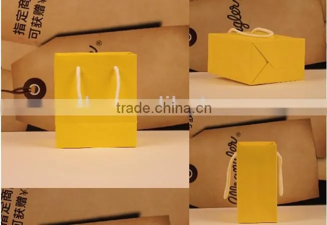 Various size popular yellow color paper bag with lamination and handles for sale