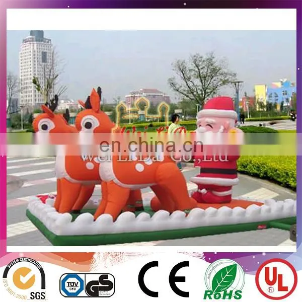 inflatable santa with sleigh and reindeer
