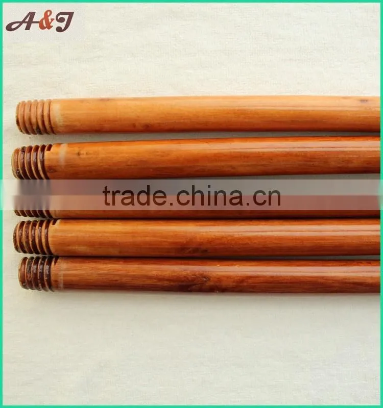 varnished wooden broom handle with long hanger