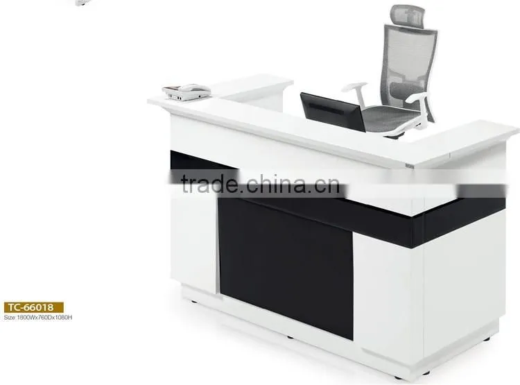 White and black MFC fitness center reception desk