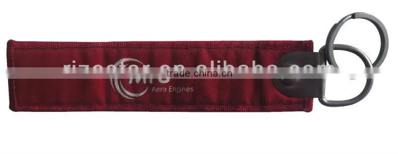 Remove before flight woven fabric keychain