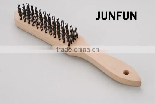 different rows wooden handle black steel wire brush