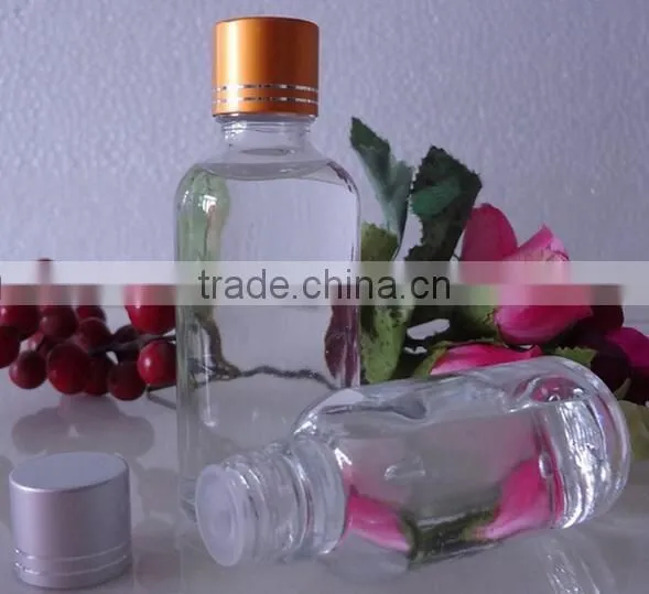 Small wine glass bottle with golden lid odd-shaped glass wine bottle