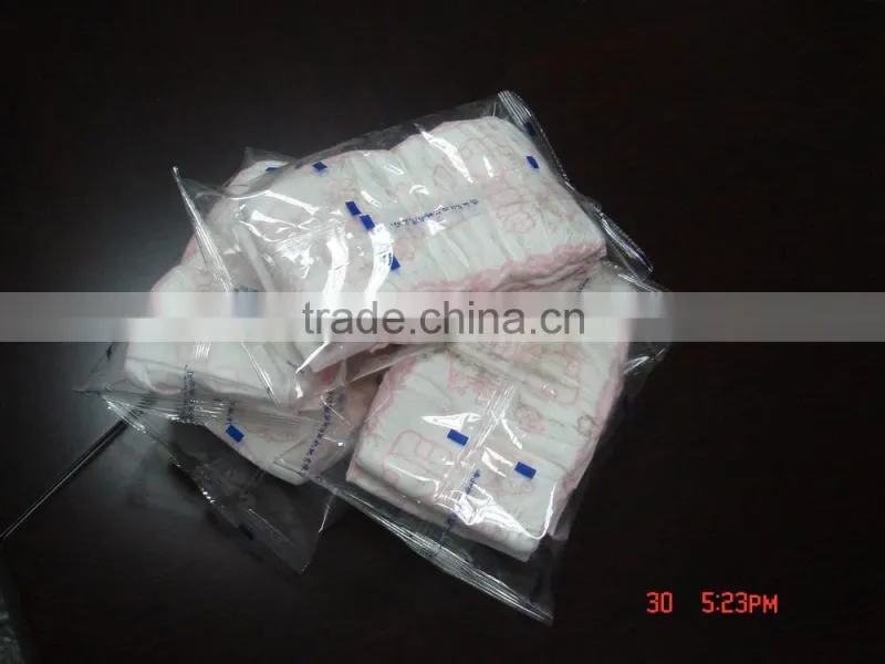 High speed sanitary napkin tissue paper roll packing machine