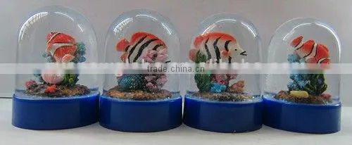 Plastic sea snow globe with boat figurine inner