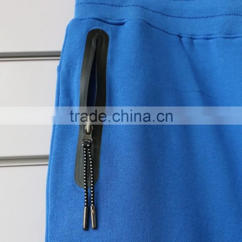 100% cotton men jogging pants with side waterproof pockets and logo print