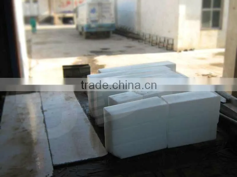 Containerized ice block machine for mobile ice demand