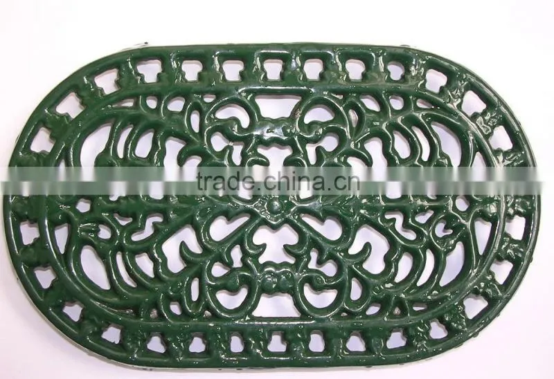 green cast iron cooking trivet