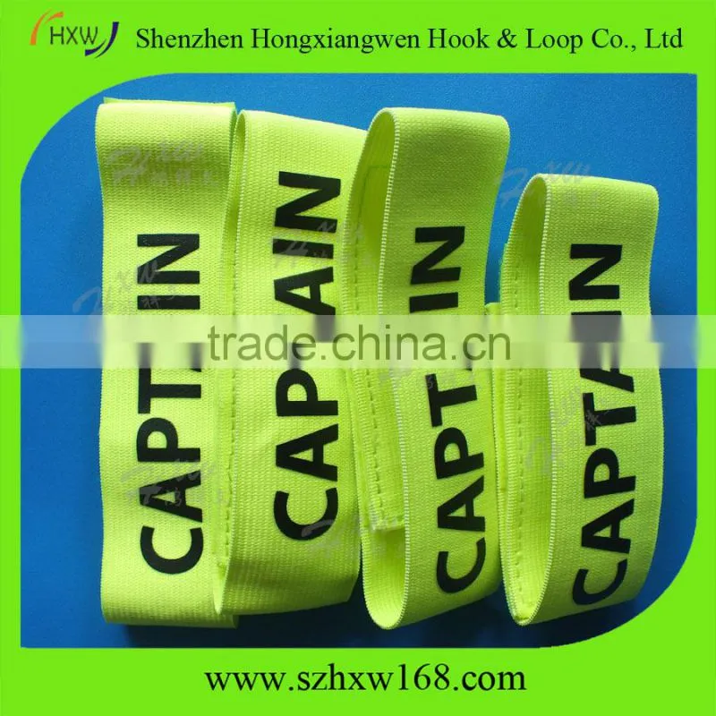 Adjustable captain arm band with hook and loop closure