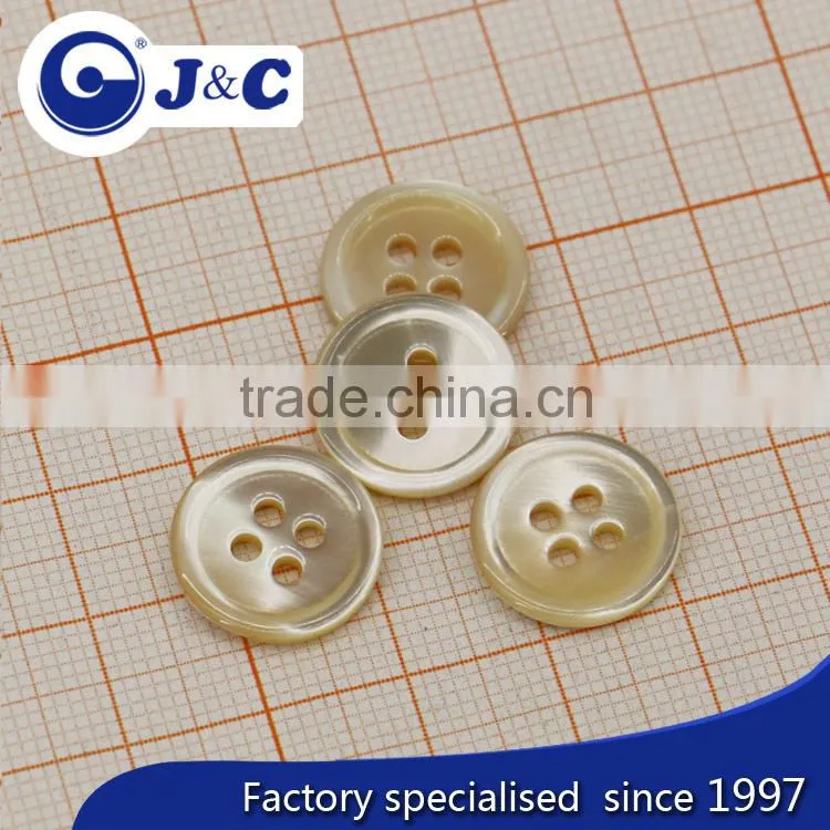 cream coloureed trocas shell button