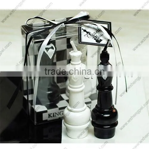Wedding candles on the chess king and queen