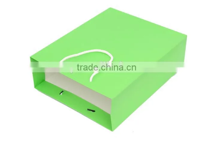 Green bright paper handmade handbag of gift box