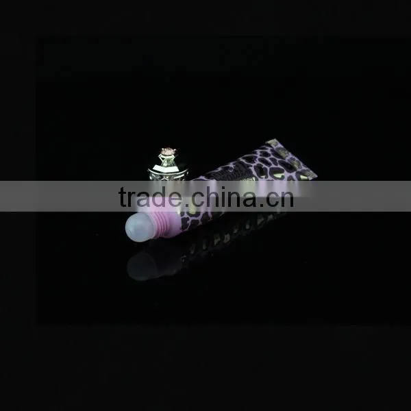 Black lipstick tube with crown cap with foil printing