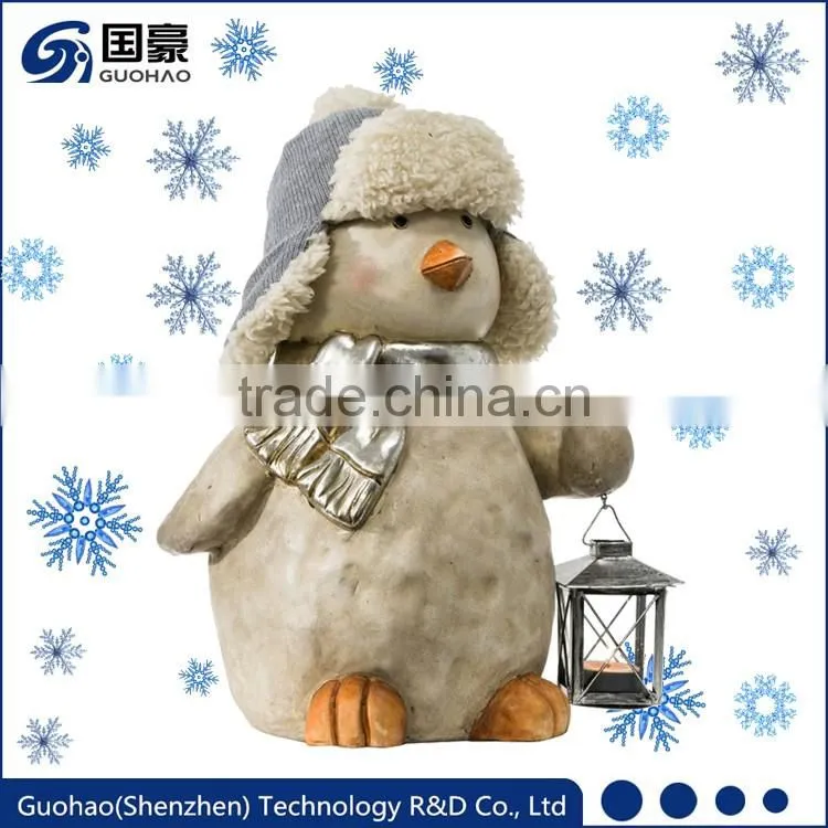 Garden penguin statue with lanterns for Christmas decoration