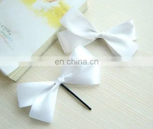 white bow tie for hair with spot