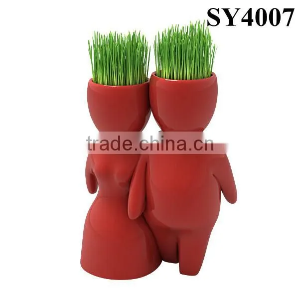 With grass hair white man growing grass doll