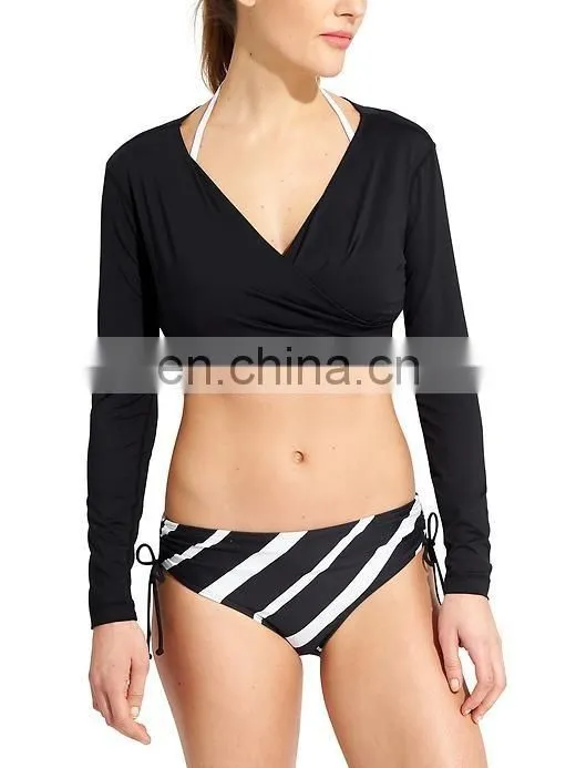 Ladies solid black swimming wear long sleeve cross front crop rash guard