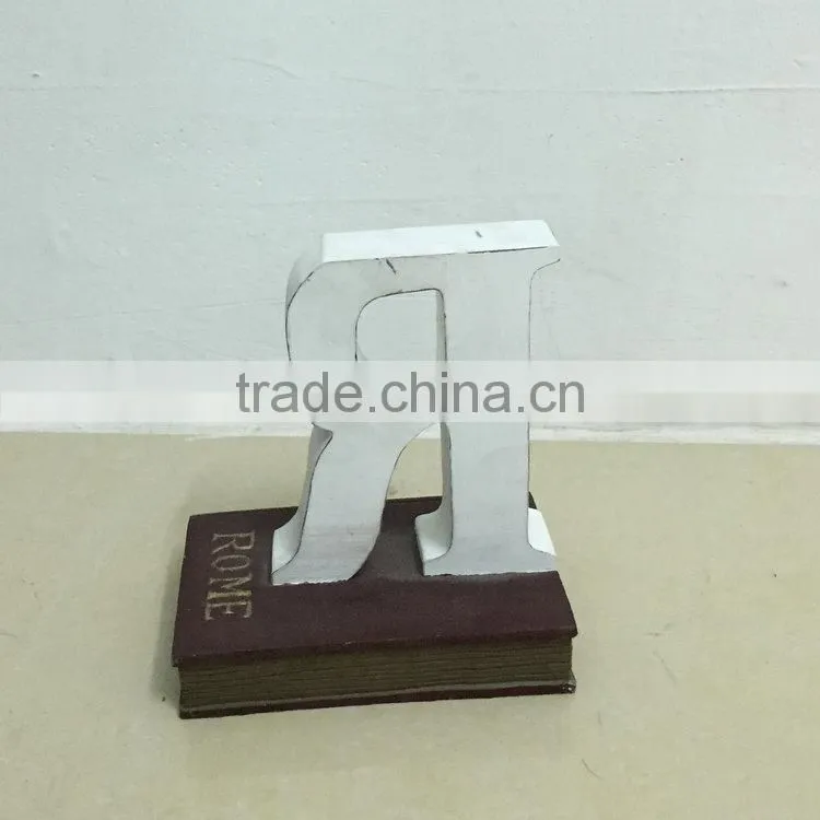 Polyresin book with letter figure