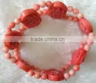 wholesale 7" 15-20mm pink round and carved natural coral beaded bracelet