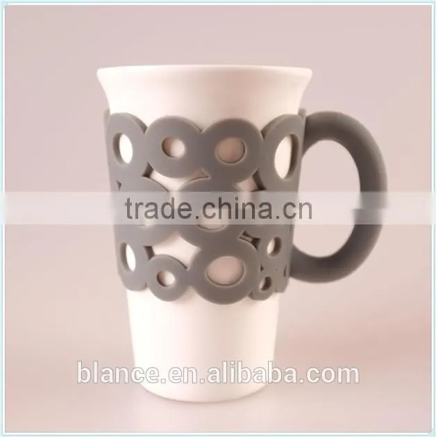 ceramic coffee mug with unique handle in silicone