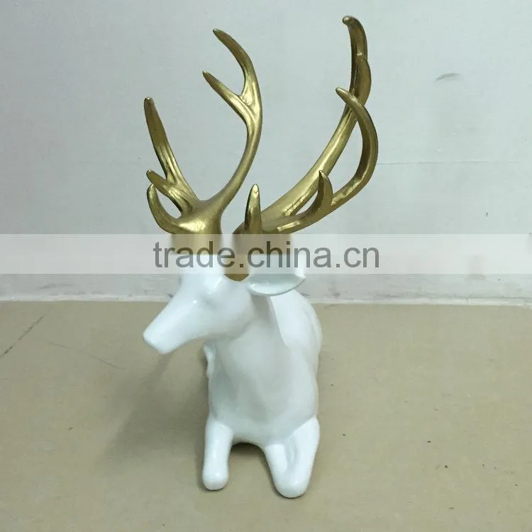 Resin sitting reindeer statue