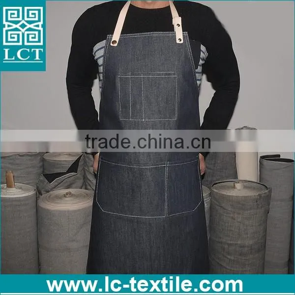 black denim apron with leather straps