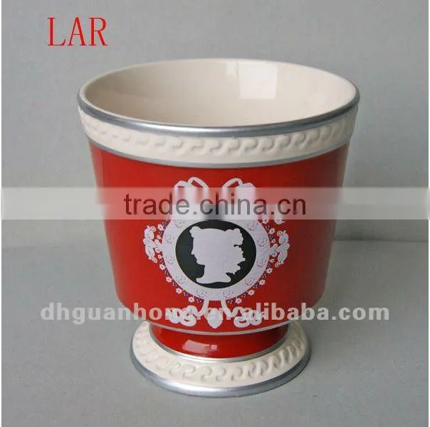 Stock ceramic flower pot in pink color round shape