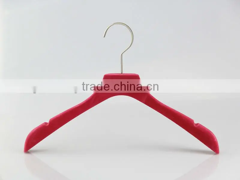 Pink velvet dress hanger with gold stamped logo