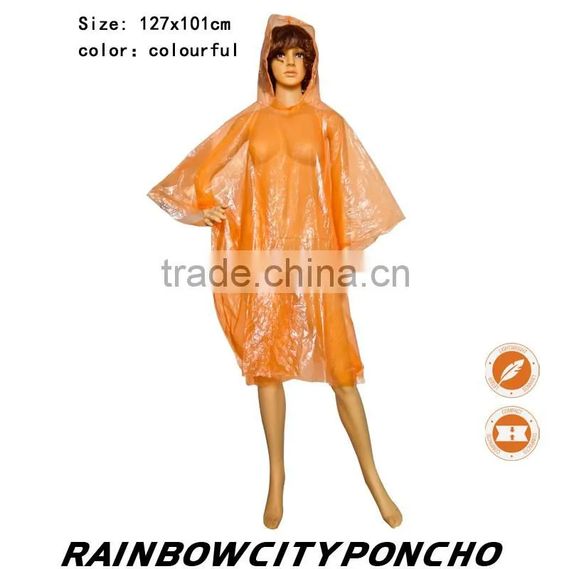 PE rainponcho orange color within paper card in the packing zipper bag