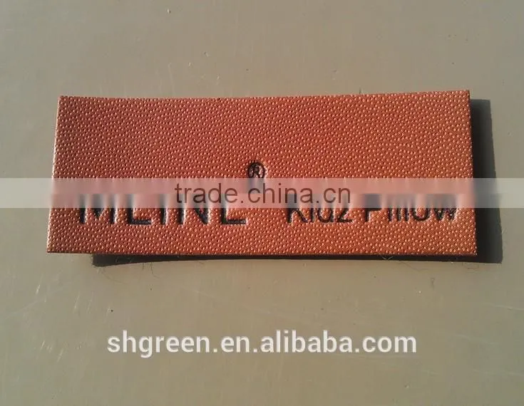 Dark brown irregular false leather label for pants