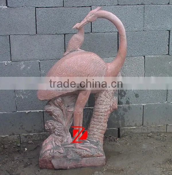 stone bird garden statue with cub