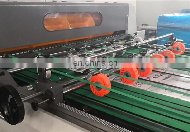 UCM1900A High Speed 4 Roll Automatic Paper cutting slitting Machine with conveyor belt stacker