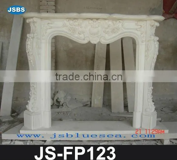 Carved white marble fireplace frame