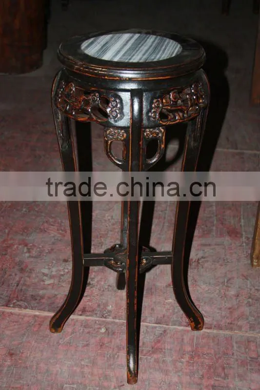 red wooden flower stool