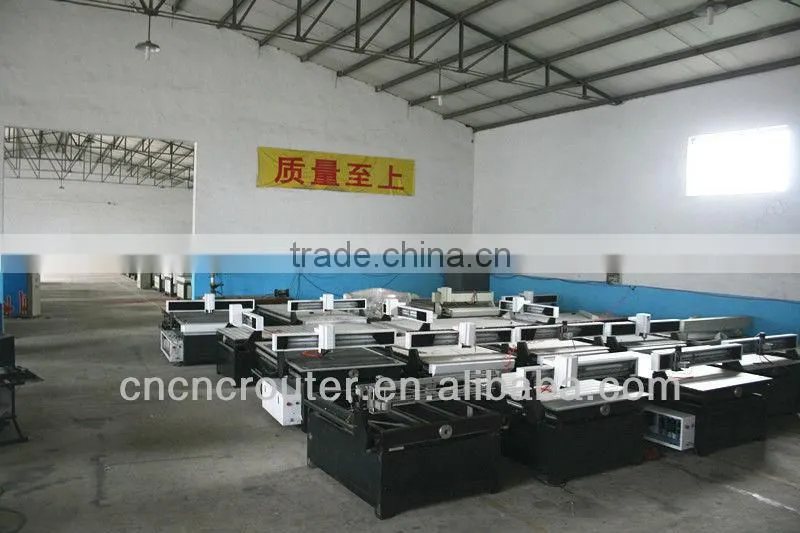Jinan woodworking cnc machine 3d for sale with the rotary clamp on front of the vacuun table