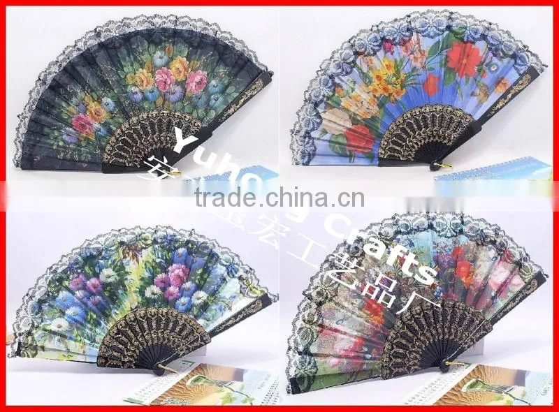Spanish style plastic folding fan with flower