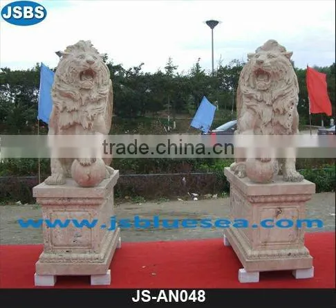 Carved travertine lion statue