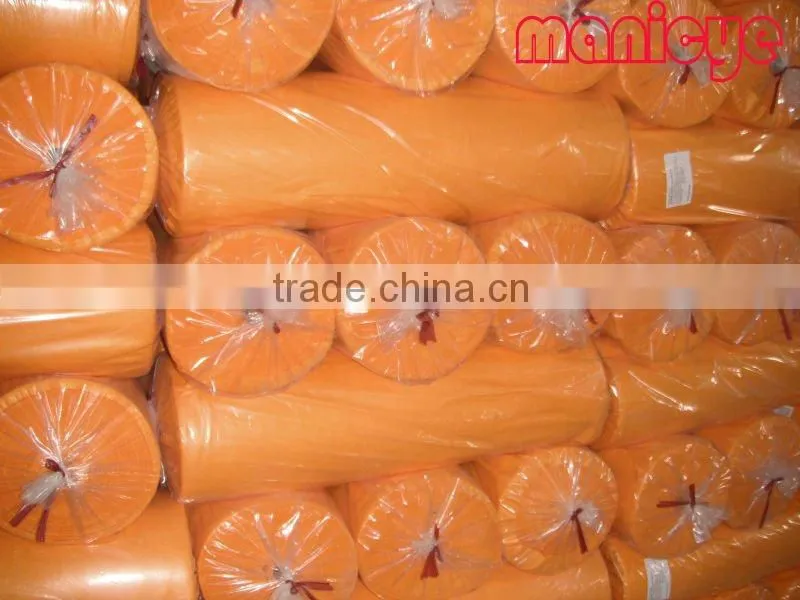 Coloured nonwoven fabric