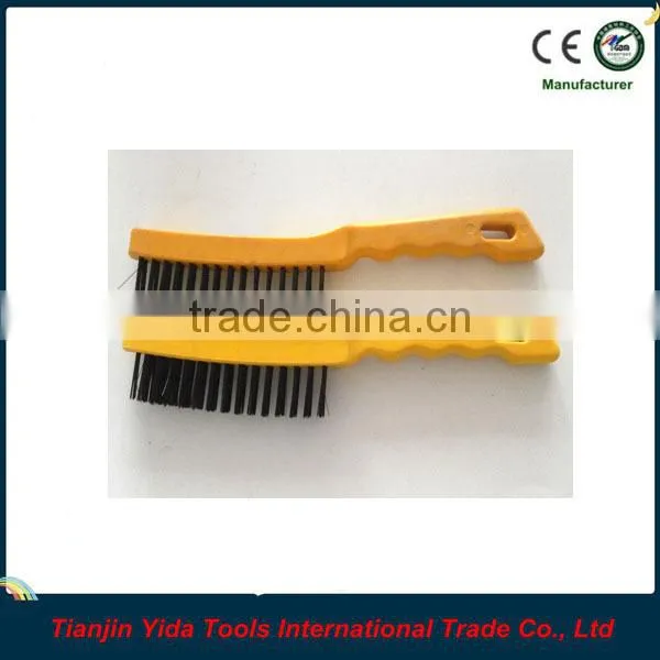 black wire brush with plastic handle