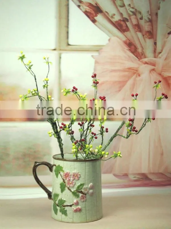 ceramic handle vase with flower design