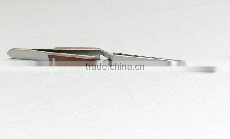 TWEEZERS CROSS LOCKING