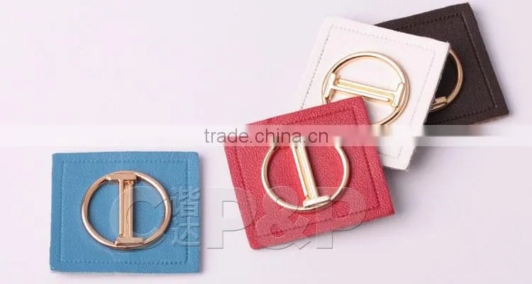 Delicate metal label branded leather patch in garment