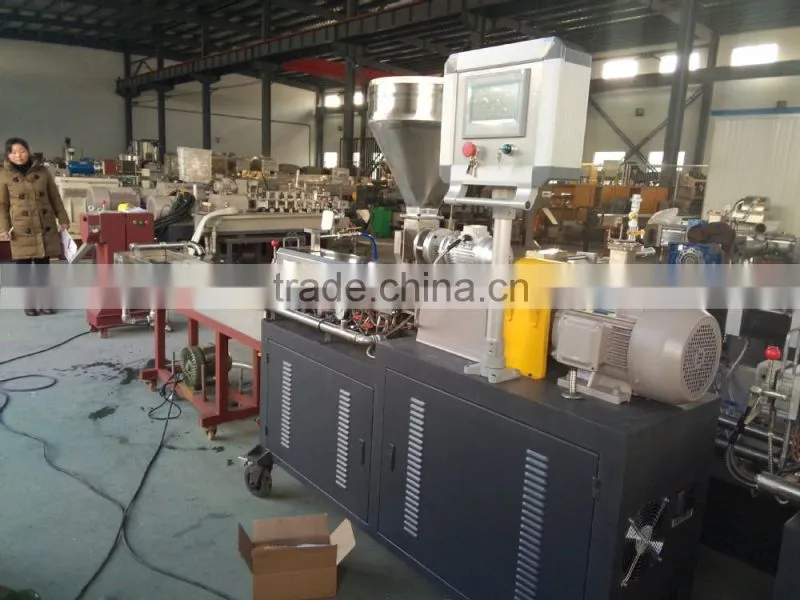 rotating helical auger conveyor to move granular materials