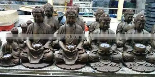 stone little monk statue