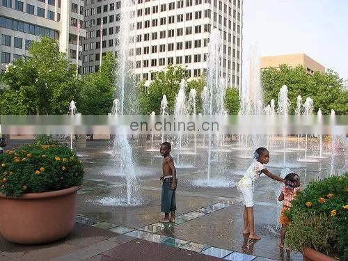 Outdoor kid playing colorful music dancing floor fountain