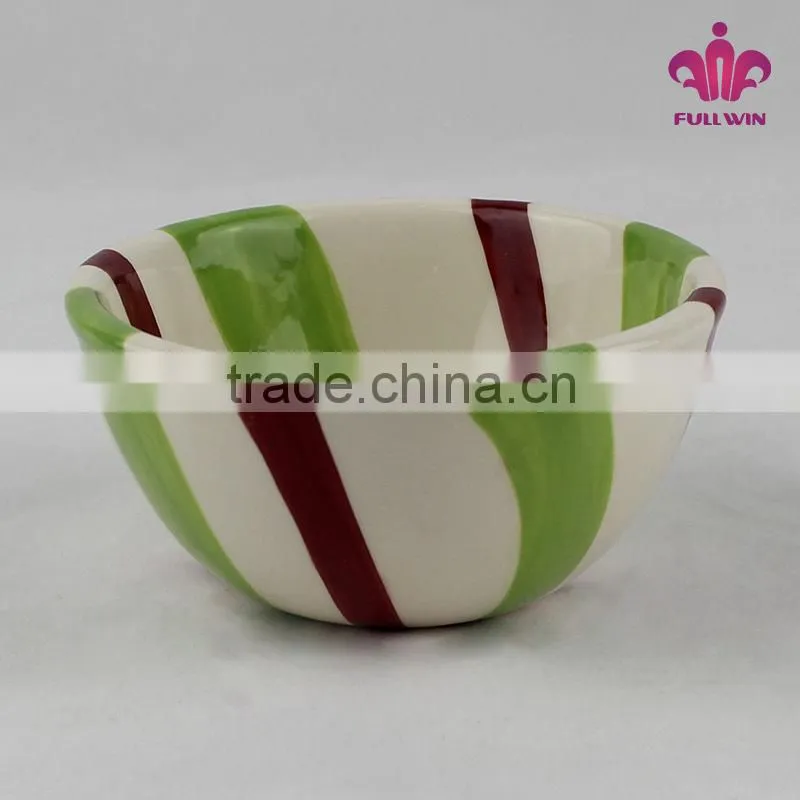 Colorful ceramic bowl with candy stripe design